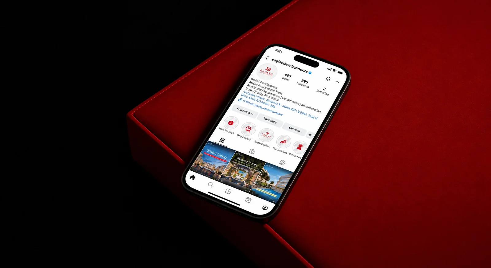 حساب Eagles Developments على إنستجرام معروضًا على هاتف، مع القصص المميزة ومنشورات المشروعات.