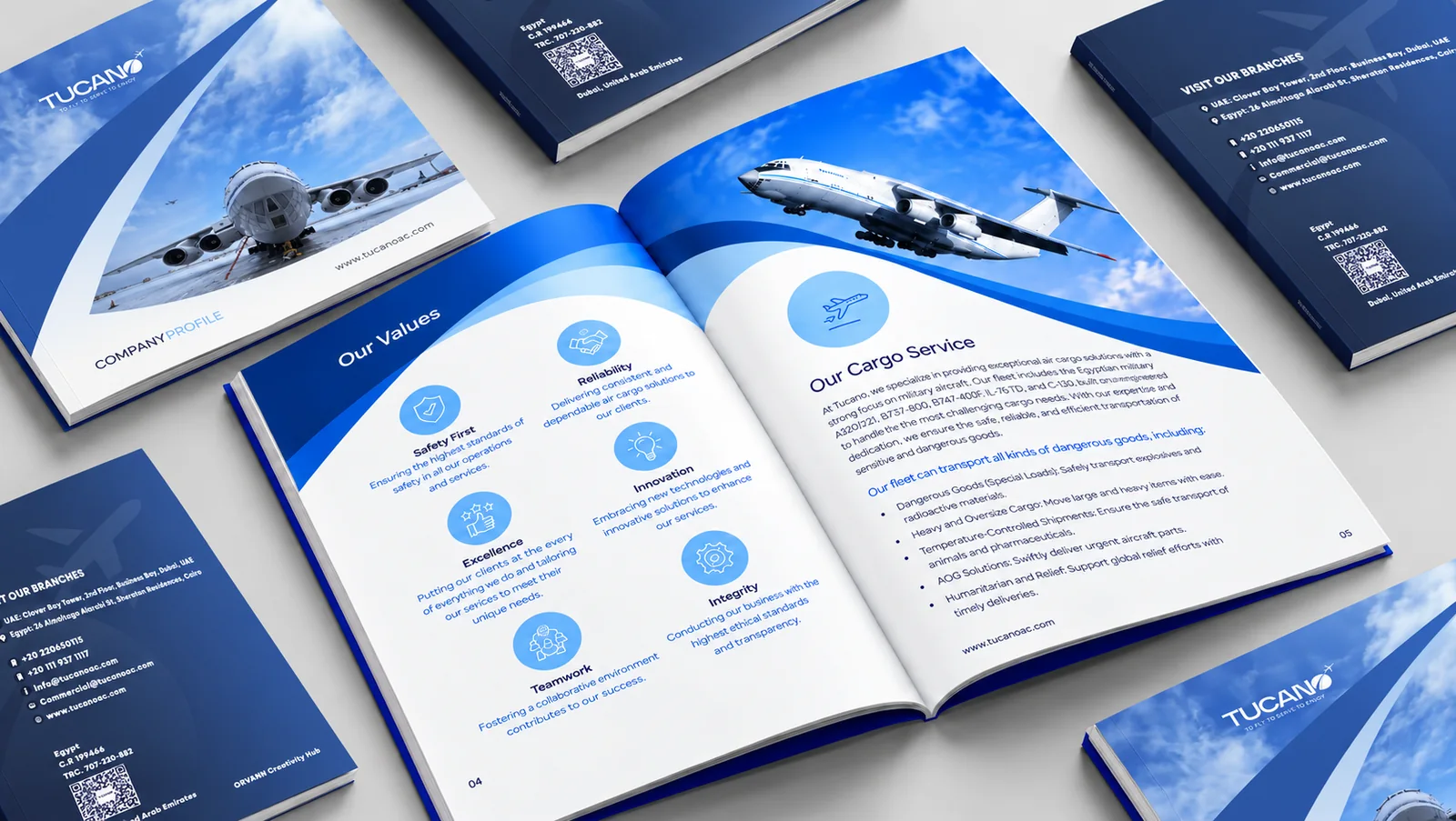 Tucano company profiles open at its values and cargo service pages, beside blue covers with private jets.